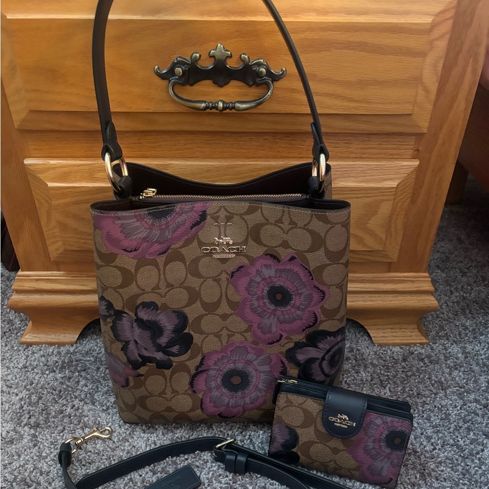 Coach shoulder/crossbody with matching wallet.